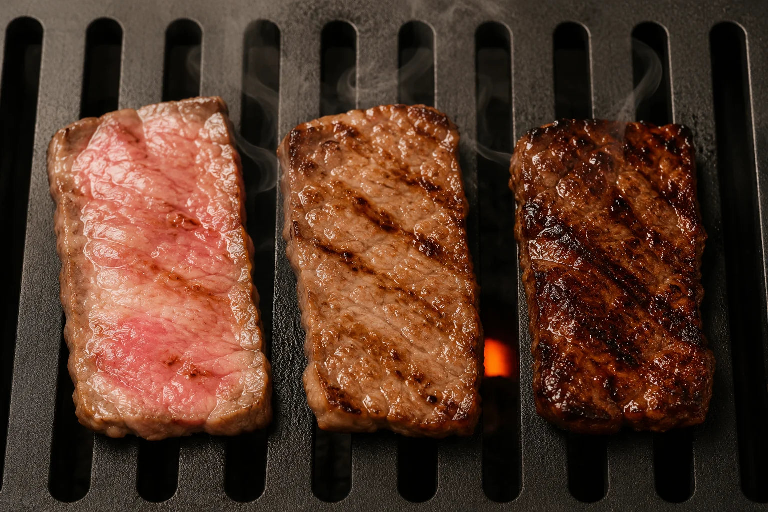 Three levels of beef doneness on the grill